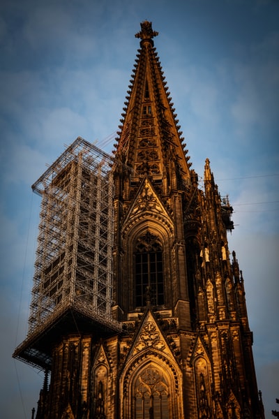 Brown concrete cathedral during the day
